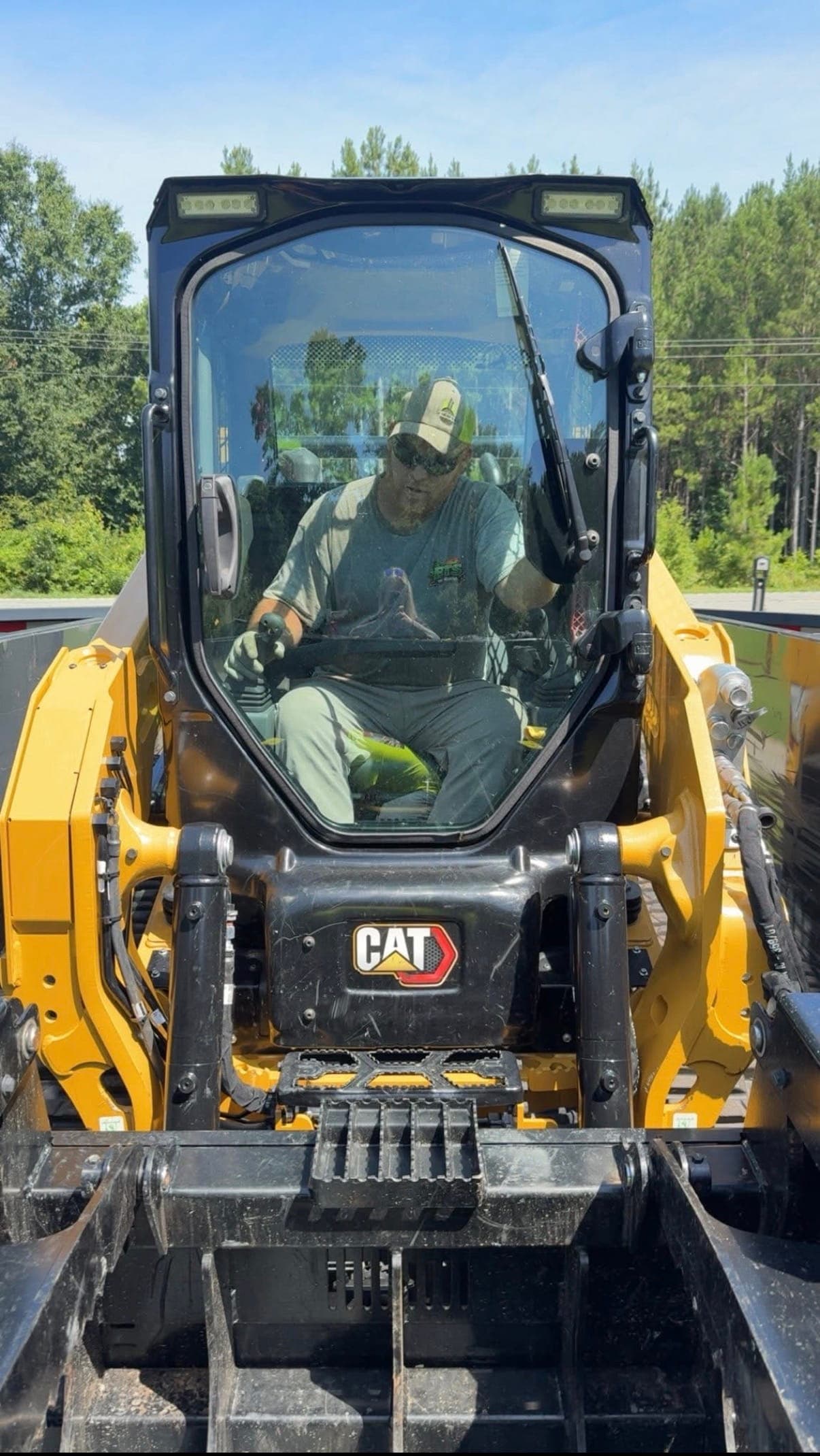 BTS Tree Removal CAT skid steer loader on a tree service job